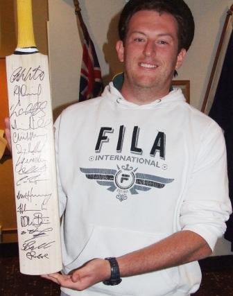 Peter Whebell with the signed Victorian cricket bat he won at our auction - organised for us by Fawad Ahmed and Khalid Hassan.