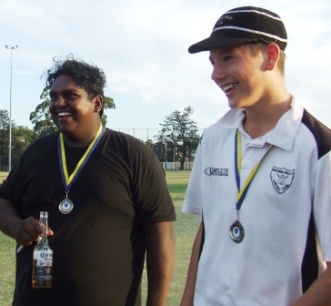 Our young guns: And don't they love it! Channa DeSilva and Jack Newman with their Premiership medals.