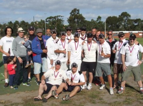 The Premiers celebrate with players who have been part of their journey to the flag. From left: Ashley Harry, Alan Harry, Darren Nagle, Sandro Capocchi, Joe Ansaldo, John Talone, Paul Edwards, Brett Curran, Mark Madden, Kevin Gardiner, Sean O'Kane, John Roberts, Steve Radford, Dean Jukic, Ian Wenlock, Mark Gauci and Paul Hobbs. Front: Dean Lawson and Peter O'Kane.