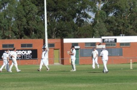 The Moment! The Final Wicket! The West Coburg bat is left mid-pitch with one of the stumps out of the ground. Peter and bowler Sean 0'Kane run in at left to keeper Paul Hobbs, while Dean Lawson and Paul Edwards move in.