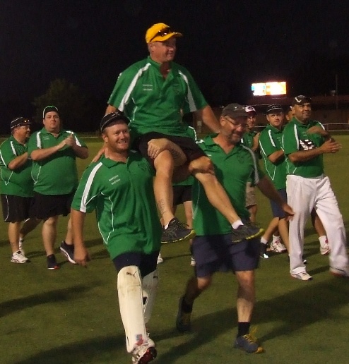 Sean O'Kane is chaired off at Barooga by his brothers Peter (left) and Mark.