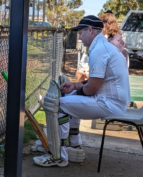 A pensive Geoff McKeown waits to go in to bat in his 200th game.