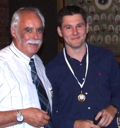President Charlie Walker (left) presented Jack Newman with his Player of the Finals medallion for the Firsts.