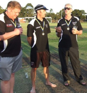 A reflection: Coach Rex Bennett speaks to the gathering on the pitch, as Simon Thornton (left) and Michael Ozbun listen on.