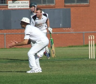 The tireless Peter O'Kane send down another delivery into the wind. Sam Carbone is ready for a catch.